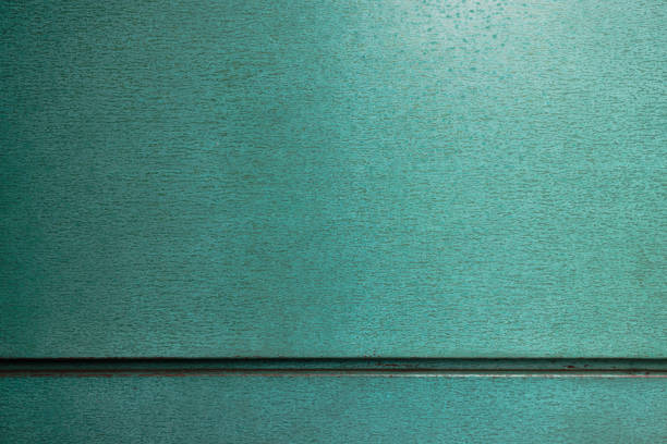 part of a patterned green metal wall.