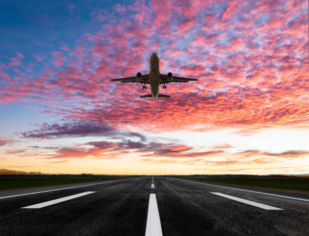 istock Passenger airplane taking off at sunset 1362853456