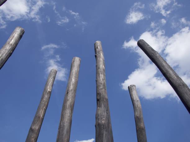 istock Burnt wooden beams against blue sky 1362856825