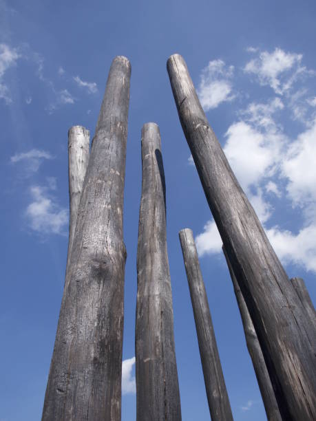istock Burnt wooden beams against blue sky 1362856839
