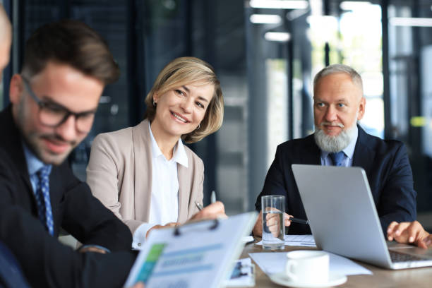 istock Group of business partners discussing ideas and planning work in office. 1362856861