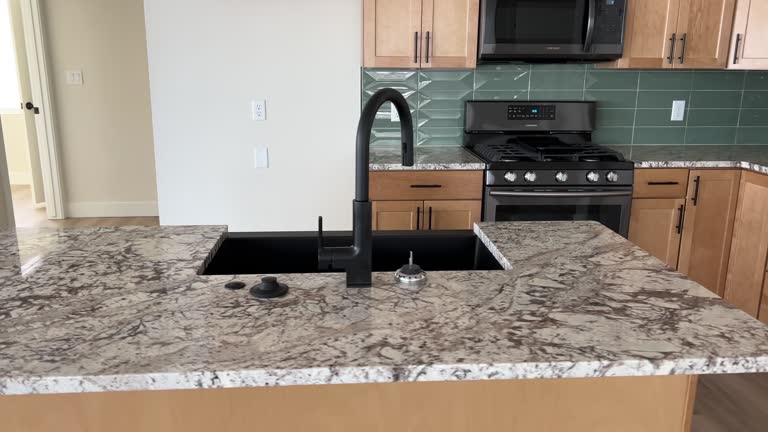 Inside new construction kitchen with newly installed cabinets and appliances and beautiful kitchen island