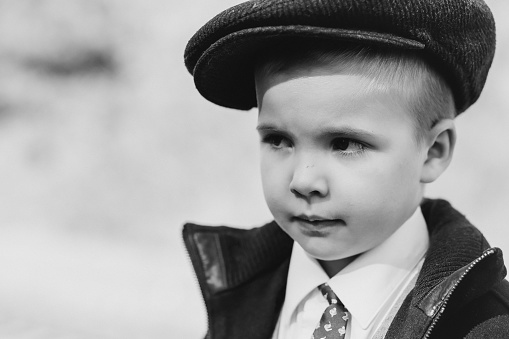 portrait of a child, boy in a cap, retro photo