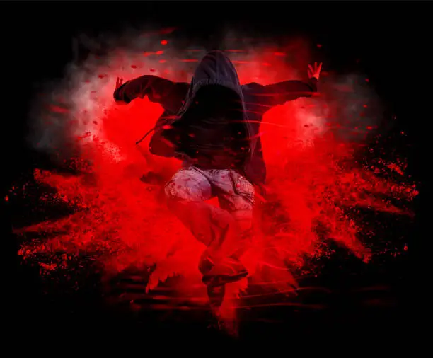 Break dance party. Young man break dancing on red smoke background