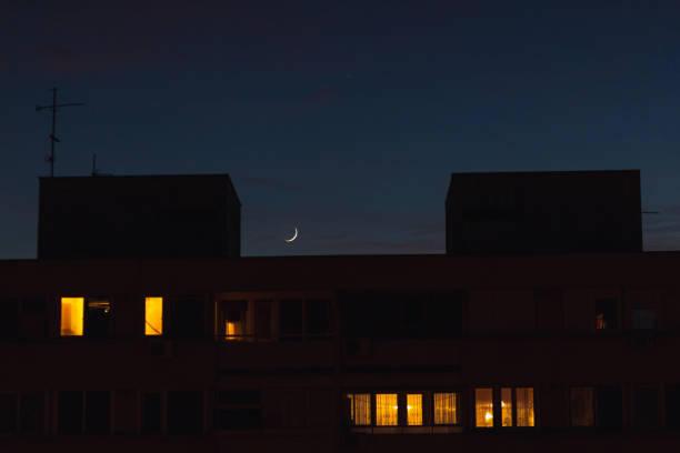 istock New moon above the building 1362866511