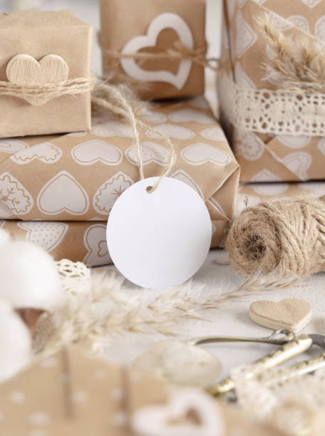 istock Valentines present with round blank gift tag close up, Rustic Mockup 1362866653