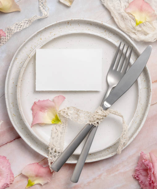 istock Wedding place card laying on a ceramic plate on a marble table 1362866672