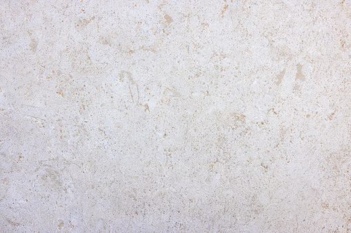 Background or texture of a granite stone with soft beige colors and brown patterns