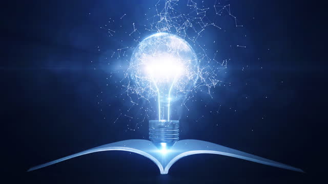 Learning from books or textbooks and the Internet around the world helps create new ideas. Slow-moving interconnected polygons surround a glowing light bulb and there is a book below. dark background