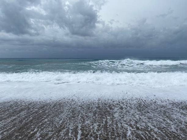 istock Big splashing waves on a stormy day 1362869285