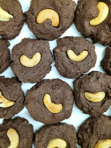 istock Chocolate Cookies and Cashew nut - white background. 1362870171