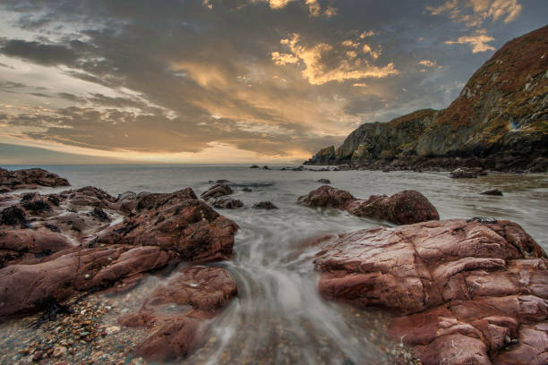 A beautiful evening sunset over Lyme regis bay on the jurassic coast in Dorset England.