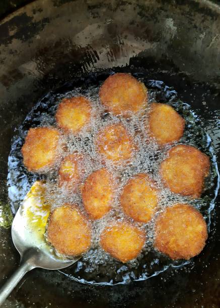 istock Frying Shrimp Cakes in cooking pan - food preparation. 1362870923