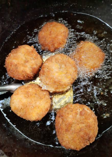 istock Frying Shrimp Cakes in cooking pan - food preparation. 1362870924