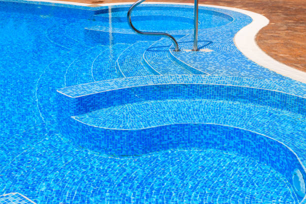 Swimming pool with clear water at a tropical resort stock photo