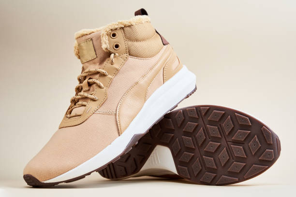 istock Male winter shoes on beige background 1362872934