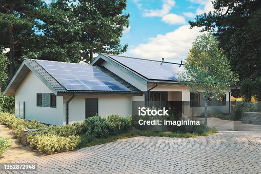 istock Energy Efficient House With Solar Panels And Wall Battery For Energy Storage 1362872948