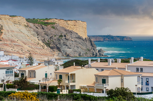 Cityscape of Praia da Luz in the Algarve in Portugal. In the background the rocky coast