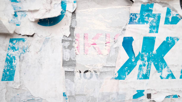 istock Ripped street poster background. Weathered paper abstract texture. 1362878070