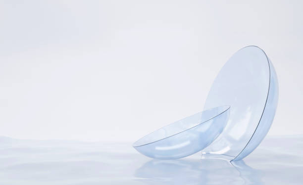 Contact lenses for vision correction on water surface, liquid solution for cleaning couple blue clear lens. Medical equipment for eye care, personal accessory, mockup for package design, 3d render