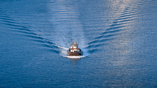 Aerial view of tugboat moving in pacific ocean, Hawaii Islands, USA.