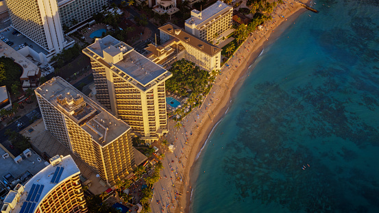 Aerial view of modern skyscraper, waterfront hotels and beach at Waikiki, Hawaii Islands, USA.