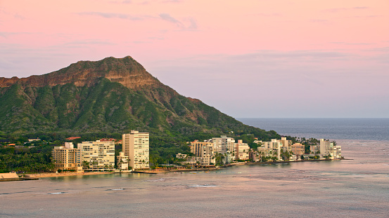 Aerial view of Diamond head mountain and modern buildings, Honolulu, Hawaii Islands, Oahu, USA.