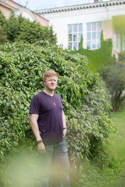 istock Man stands by green bush during lunch break 1362880560