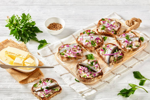 istock pickled sprat rye bread open sandwiches, top view 1362880833