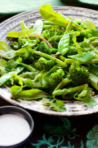 vegetable salad with  broccoli; asparagus,green pea and  dressing