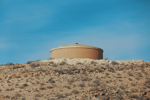 Water tank in wild deserted area