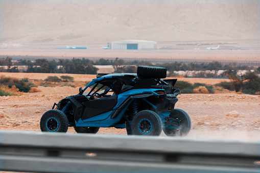 Buggy car driving in off road  in red desert