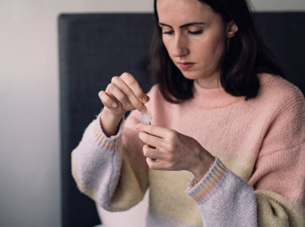 istock Woman holding self-testing swab and rapid test for Coronavirus/COVID-19 1362882266