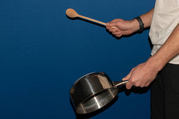 istock Hitting a pan with a wooden spoon 1362882276
