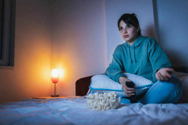 istock Woman watching TV 1362883444
