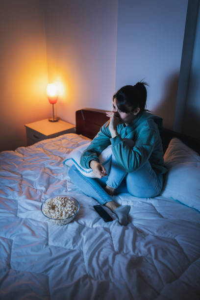 istock Woman sad while watching TV 1362883552