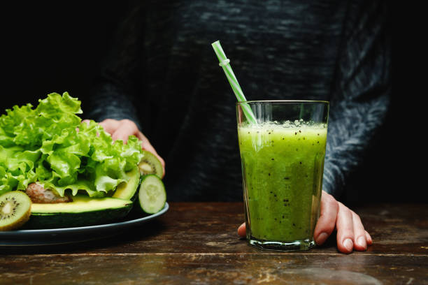 istock Woman making detox smoothie at home. 1362883568