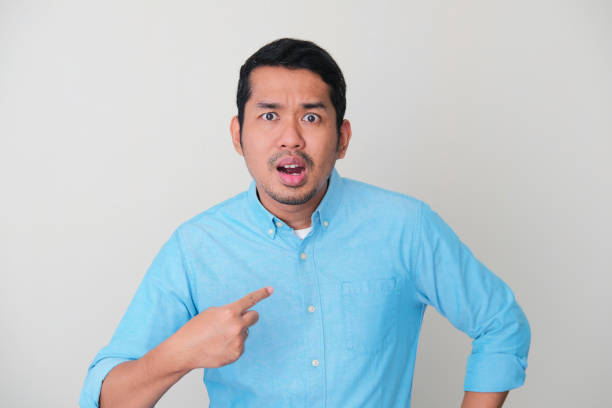 istock Asian man pointing to his self with angry expression 1362883890
