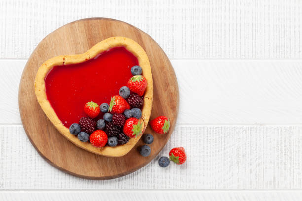 istock Heart shaped sweet cake with berries 1362884728