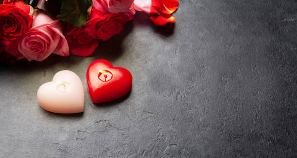 istock Rose flowers and heart candles 1362884935