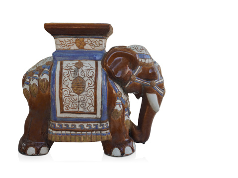 side view antique brown and blue big elephant ceramic standing on white background, vintage, object, animal, decor, copy space
