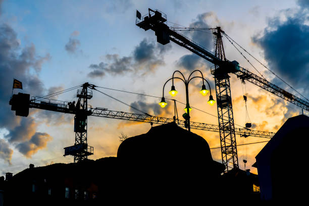Image of Construction site crane at dusk crane.