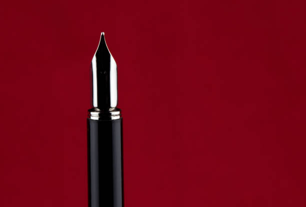 istock Fountain Pen Point on a Red Background 1362890118