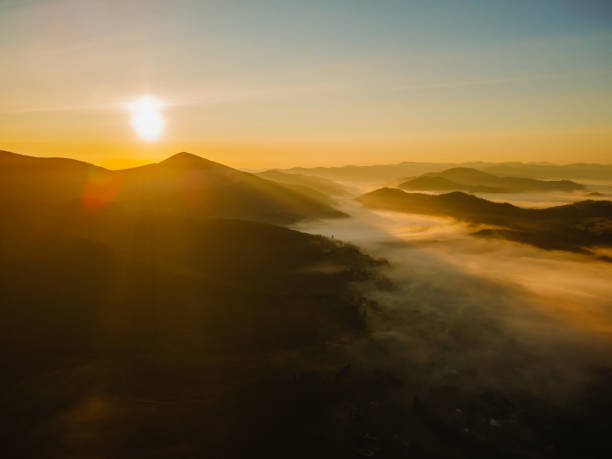 istock aerial view of sunrise above mountain range 1362890371