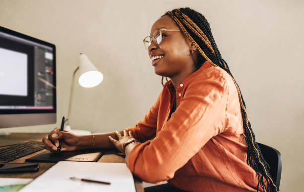 Smiling female freelancer working on a new design