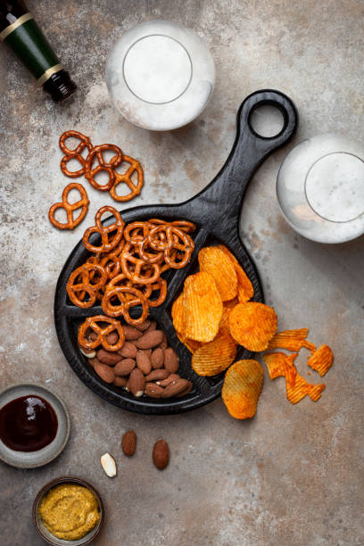 istock Fresh beer snacks assortment on wooden board 1362891943