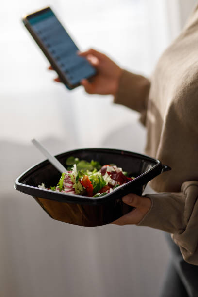 istock Texting friends while enjoying takeaway lunch 1362891990