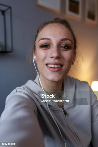 Joyful Teenage Girl Looking At Camera As If She Is On A Video Call Stock Photo - Download Image Now