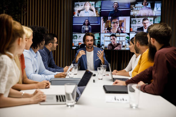 istock Manager leading a meeting with a group of his employees 1362893641