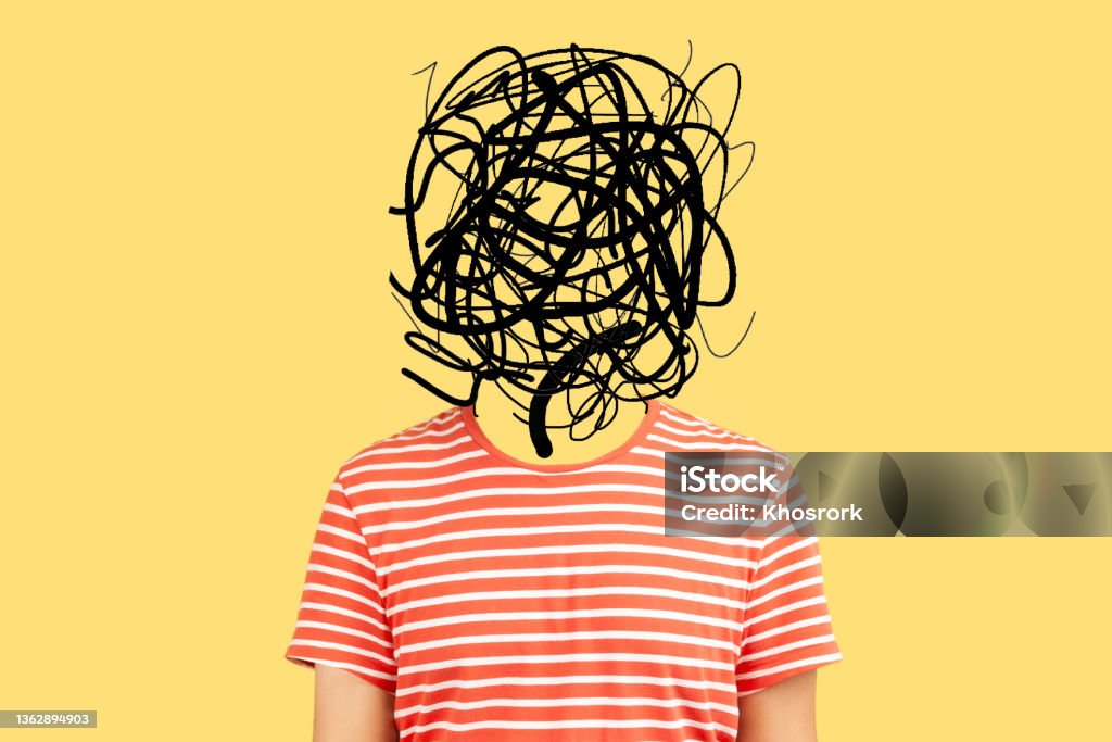Frustrated man with nervous problem feel anxiety and confusion of thoughts. Frustrated man with nervous problem feel anxiety and confusion of thoughts. Mental disorder and chaos in consciousness. Indoor studio shot isolated on yellow background Attention Deficit Hyperactivity Disorder Stock Photo
